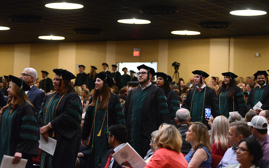 Medical school graduates file into the Jesse Auditorium during commencement